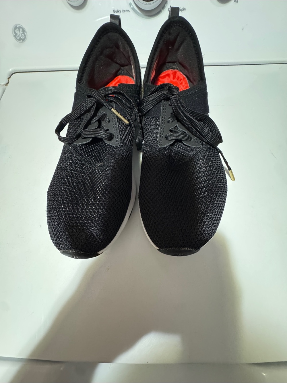 New Balance Women's Black Athletic Sneakers with Red Lining